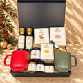 SOCALA Christmas gourmet gift box with red and green mugs, olive oil, balsamic, Cabernet cheese spread, crackers, fig pairings, honey and Jordan almonds.