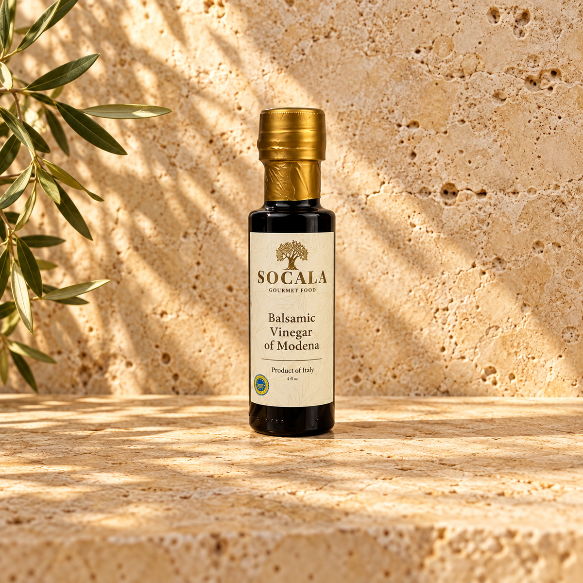 SOCALA Balsamic Vinegar of Modena bottle on sunlit travertine.