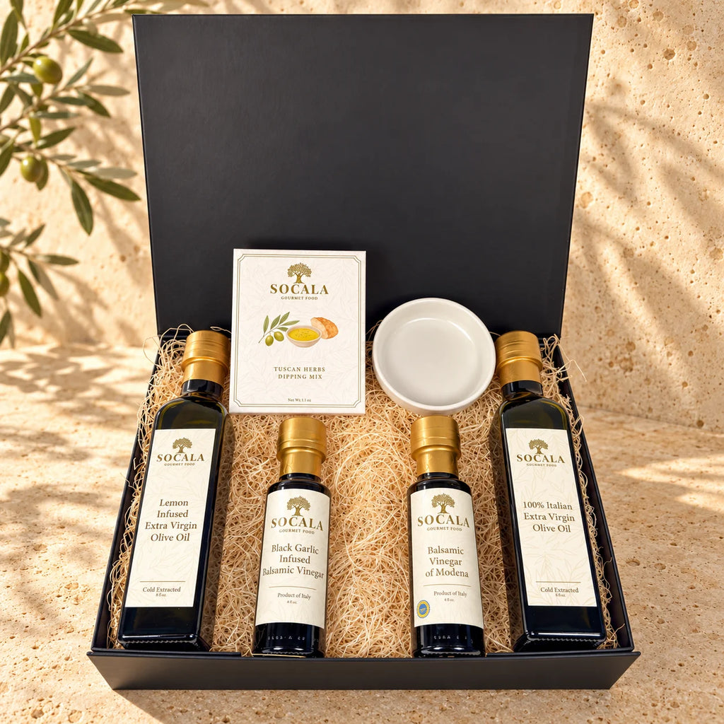 SOCALA Italian bread dipping gift set with olive oils, two balsamic vinegars, Tuscan herbs and a white dipping dish in an open black box.