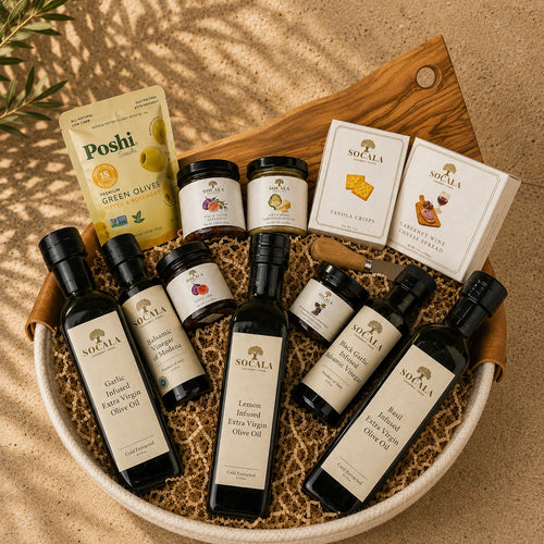 Collection of olive oil bottles and packaging on a wooden board with a natural background