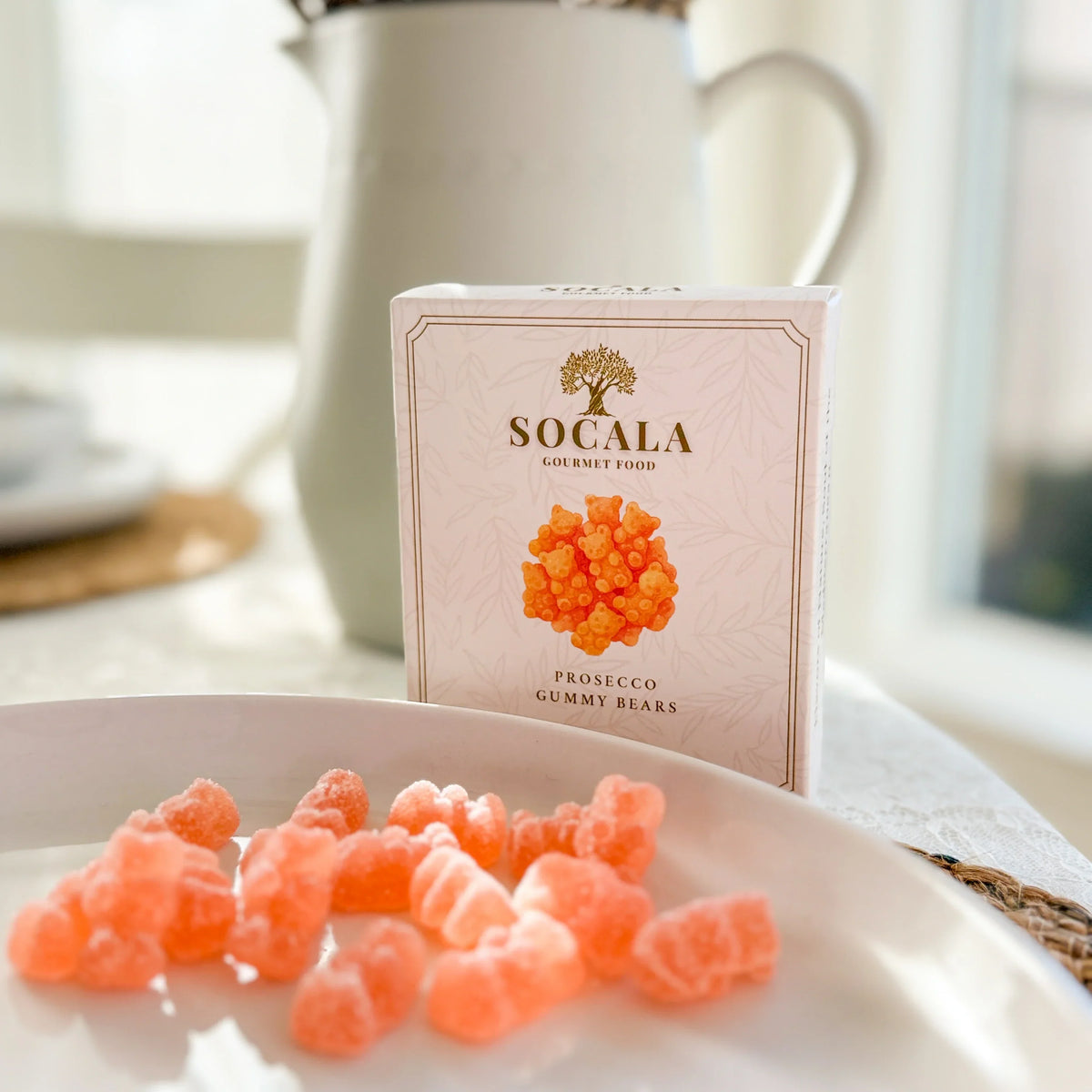 SOCALA Prosecco Gummy Bears box with gummy sweets on a serving plate.