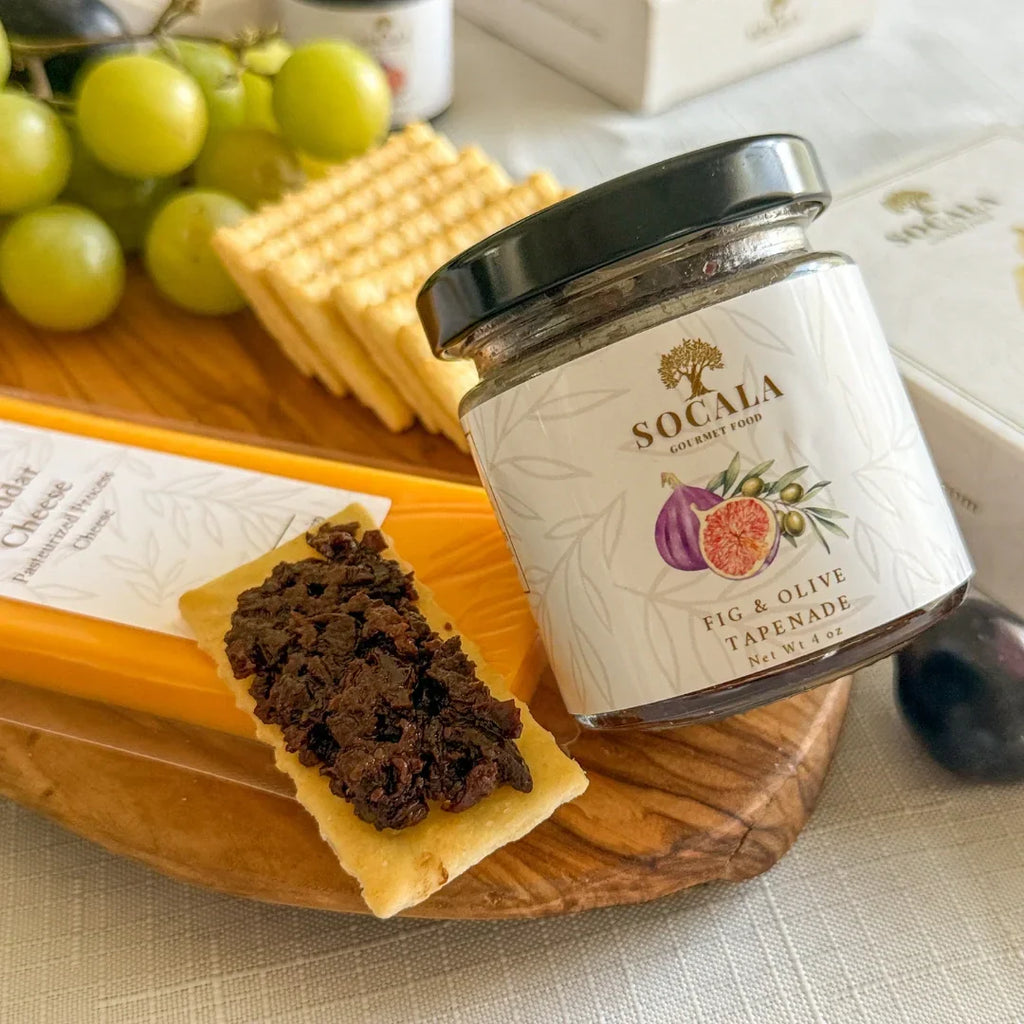 SOCALA Fig and Olive Tapenade jar with cheese and crackers as serving suggestions.