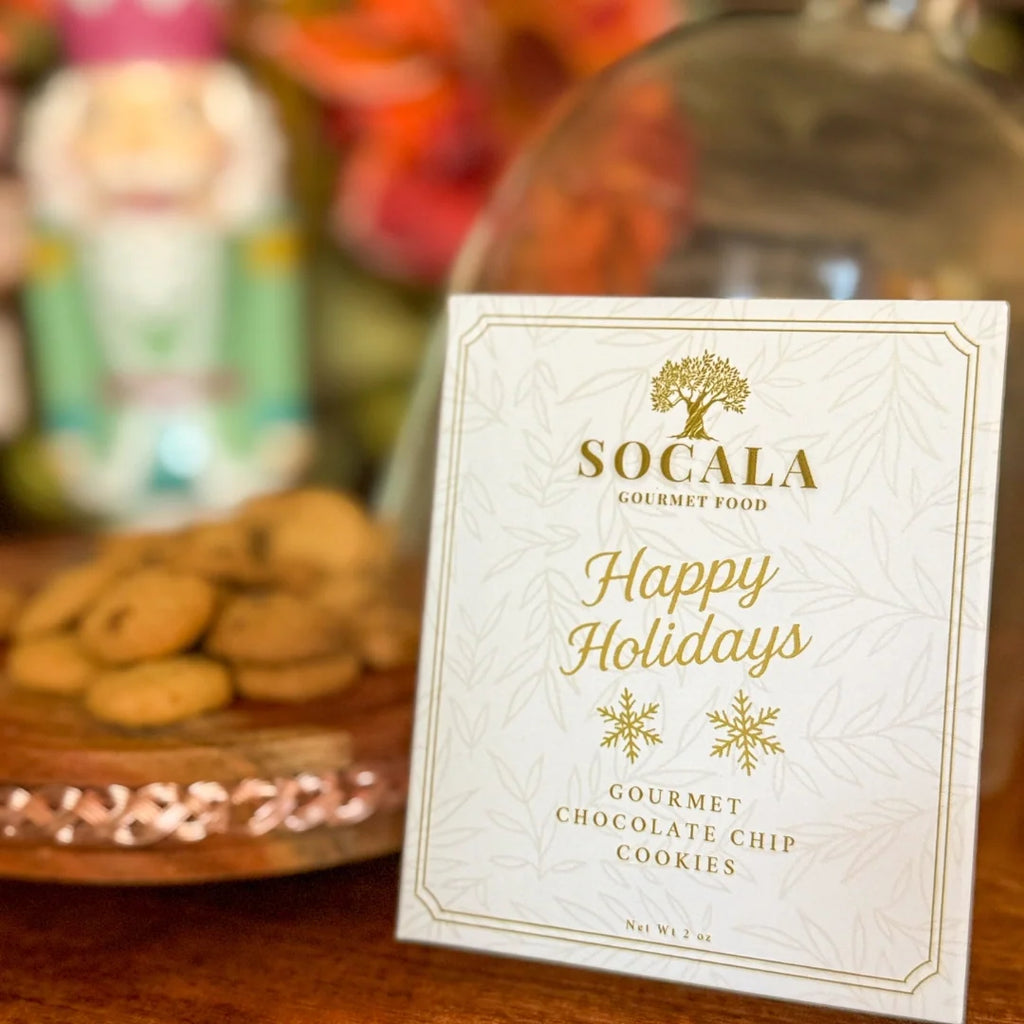 Socala Gourmet Food holiday cookie packaging with cookies in the background